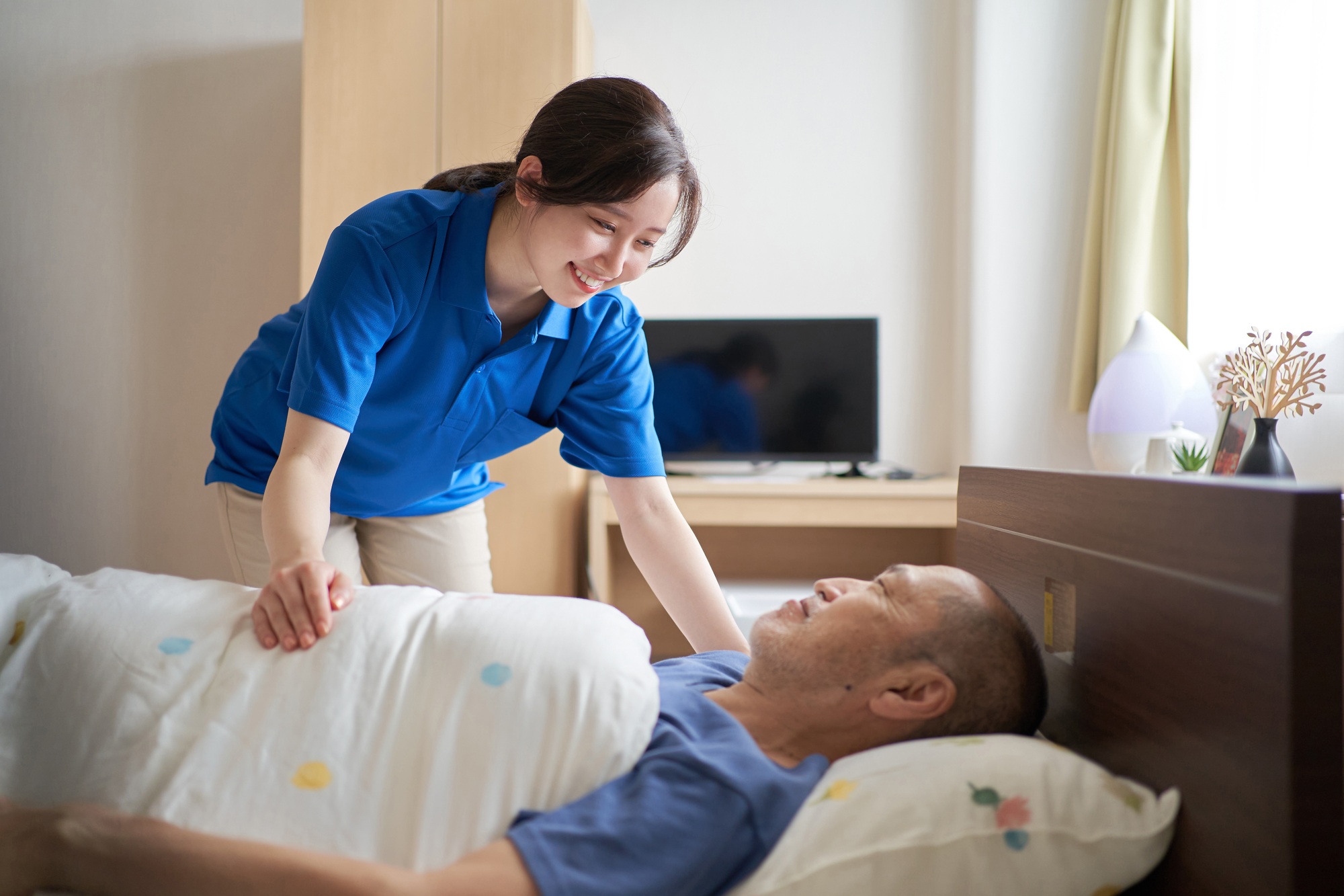 Female caregiver working in a care facility